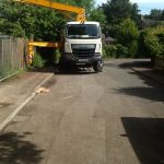 Front of concrete boom pump truck working at distance