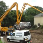 Boom extending from a truck-mounted concrete pump