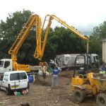 Boom extending from a truck-mounted concrete pump