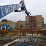 Schwing 34m Reach Concrete Boom Pump in operation at a construction site