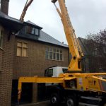 CIFA 42m concrete boom pump - pumping over the top of a house