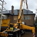 CIFA 42m concrete boom pump - pumping over the top of a house