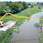 Cifa 36m concrete boom pump at work over the River Adur