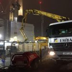 Schwing 24X 24m reach concrete boom pump working at night