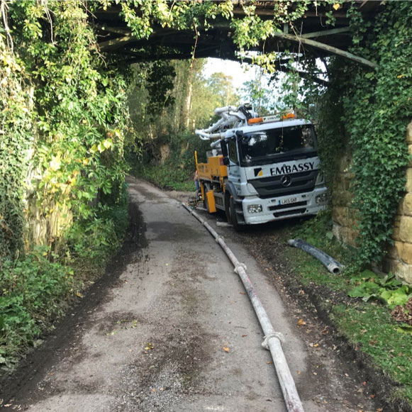 Schwing 20m book pump under bridge